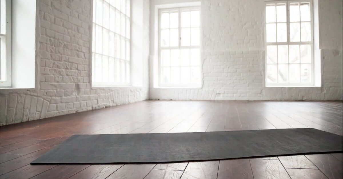 empty-white-space-loft-studio-yoga-mat-on-the-floor-picture-id674564080
